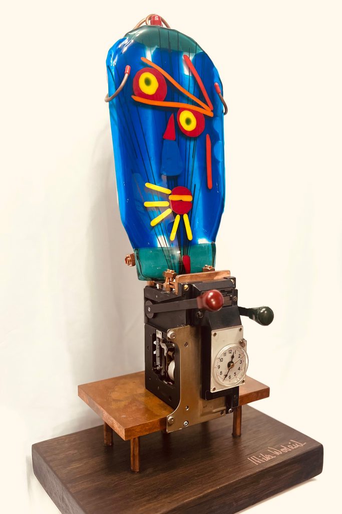 Mike works primarily with glass, though he does incorporate other mediums into his pieces.