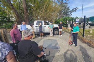 Residents gather at the Greenwood Avenue pocket park for an informal public meeting with JEA Community Relations and Project Outreach Manager Greg Corcoran on March 27.