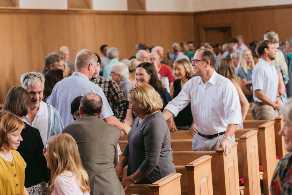 people talking inside Southside Methodist Church