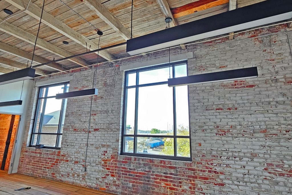 New windows, updated lighting and refinished floors are bringing the century-old building back to life.