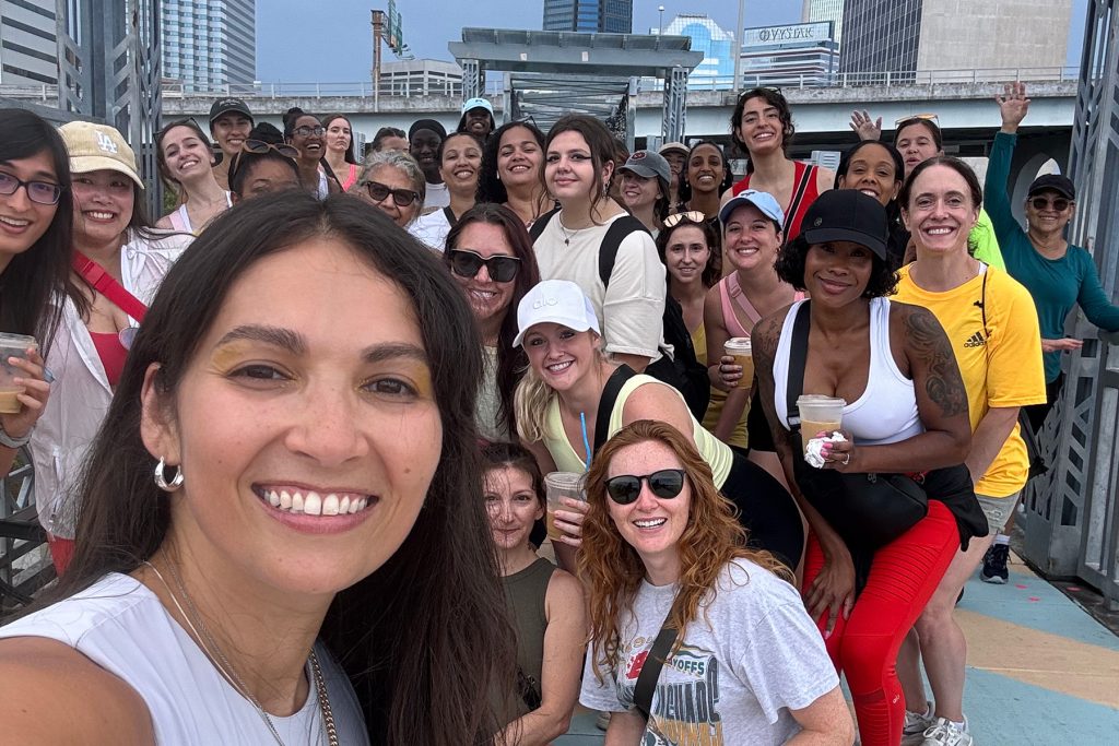 Anastacia Garcia and the walkers of @prettygirlswalkjax on a stroll through the Riverwalk