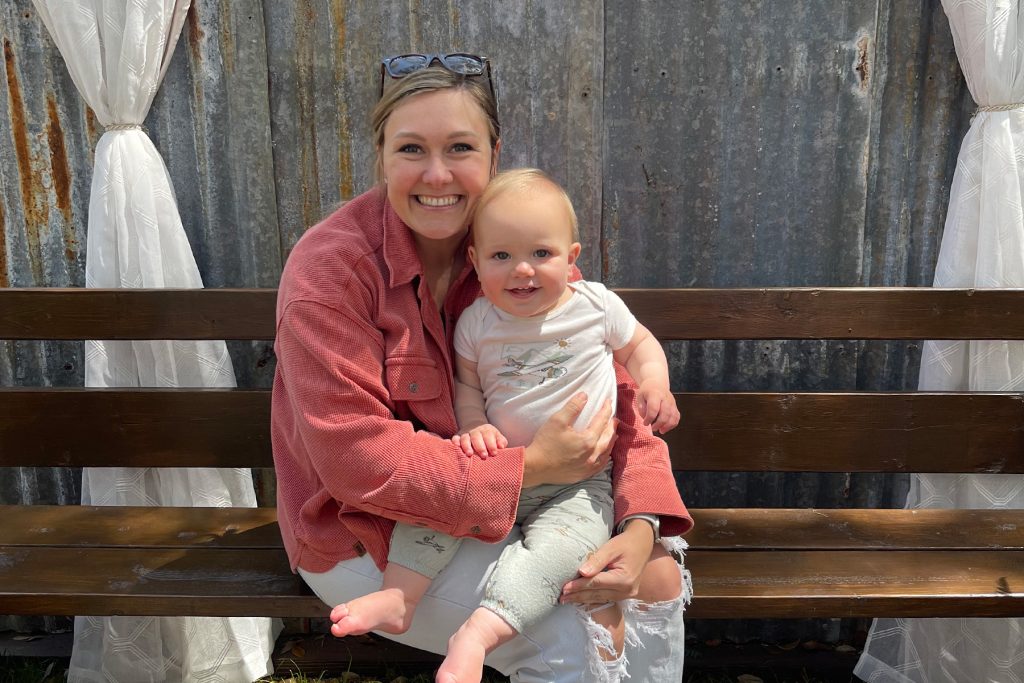 Bethany Burton DMD holding baby