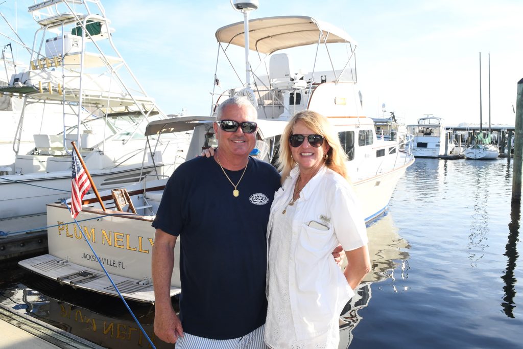 Huckins owners Mike and Daisy Davidson, in front of Plum Nelly a 1951 48’ Ortega