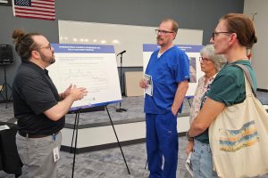 A representative with the Florida Department of Environmental Protection, Northeast District speaks with residents at the May 15 public meeting.