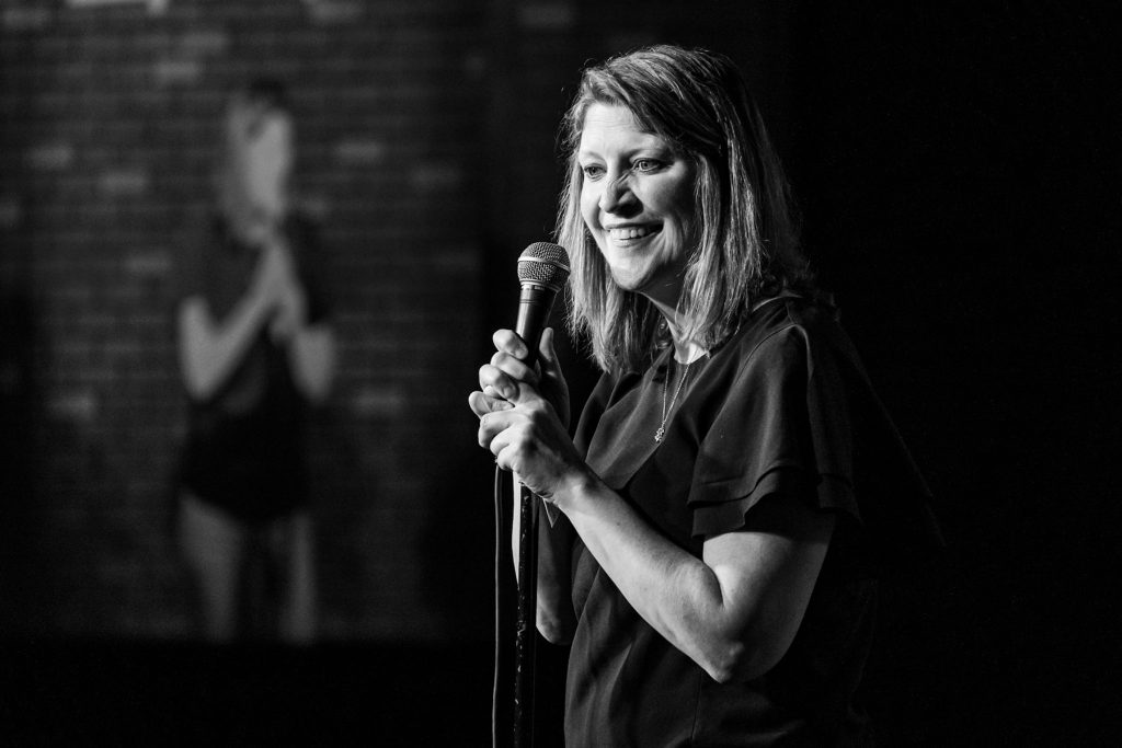 Wendy Gillis holding microphone