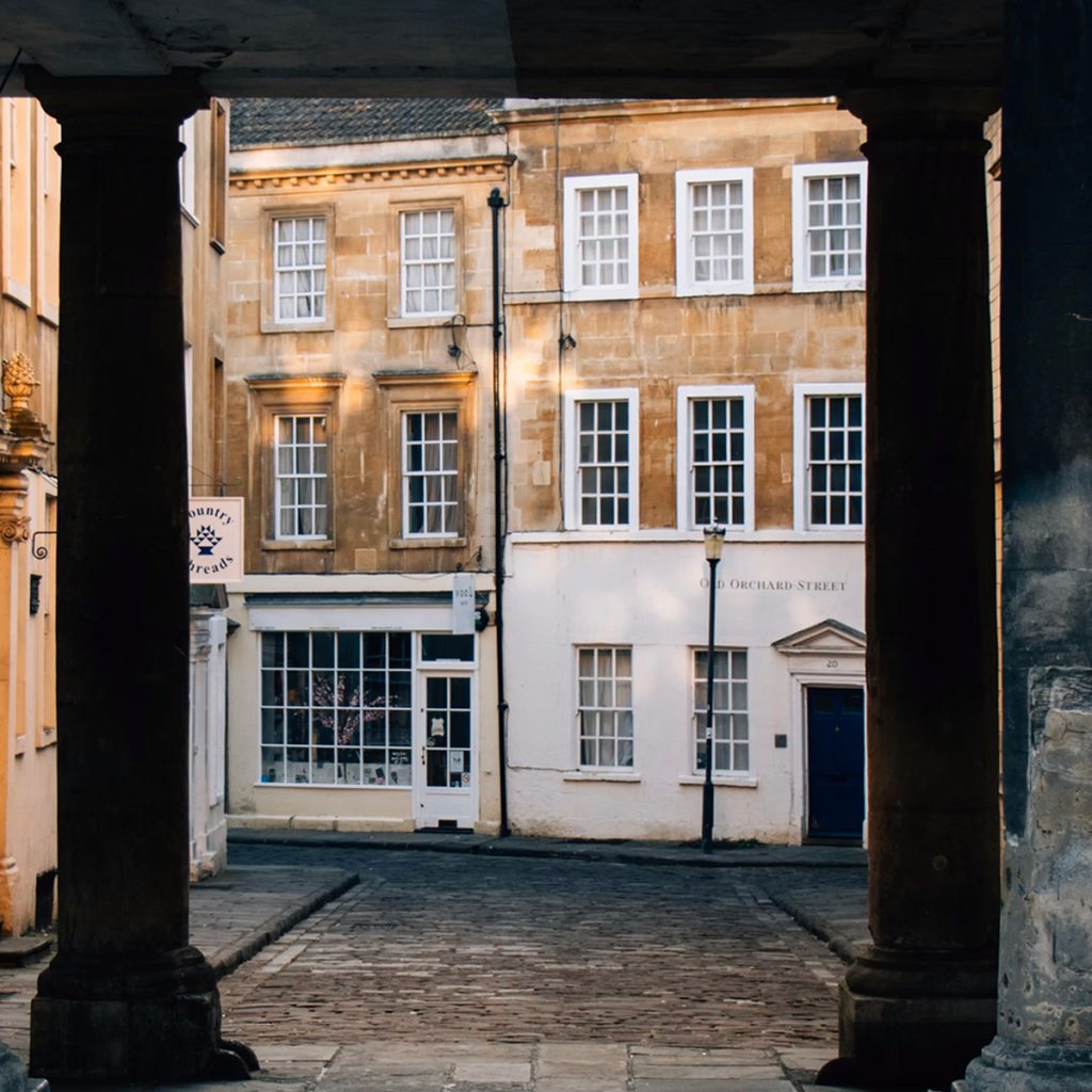 photo of storefronts seen through columns