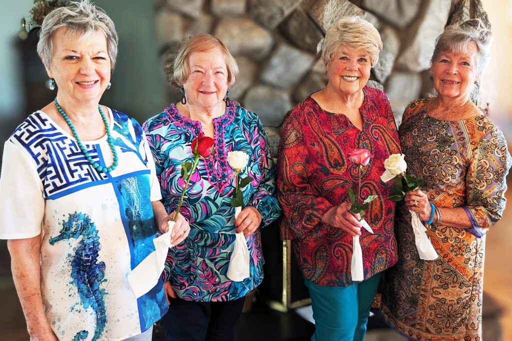 Stephanie Pyren-Fortel and Alice McCoy with Susan D. Brandenburg and Pat Setser at the National League of American Pen Women, Jacksonville Branch end-of-year luncheon celebration