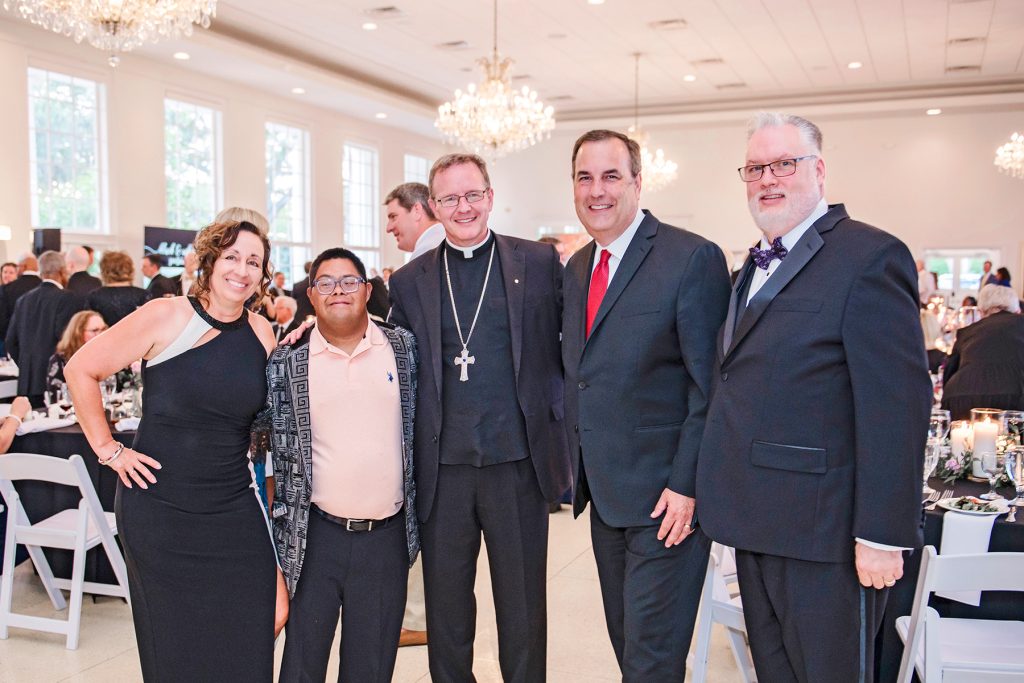 Michelle Tetschner, Raymond Tetschner and Bishop Erik T. Pohlmeier with Stacy Tetschner and Diocesan Chancellor Dennis Johnson, Jr.