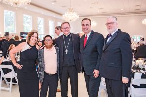 Michelle Tetschner, Raymond Tetschner and Bishop Erik T. Pohlmeier with Stacy Tetschner and Diocesan Chancellor Dennis Johnson, Jr.