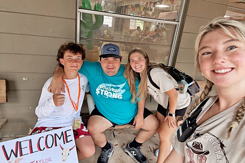 Chloe H., Allison K., Taylor P. and John M. are all smiles at Camp I Am Special.