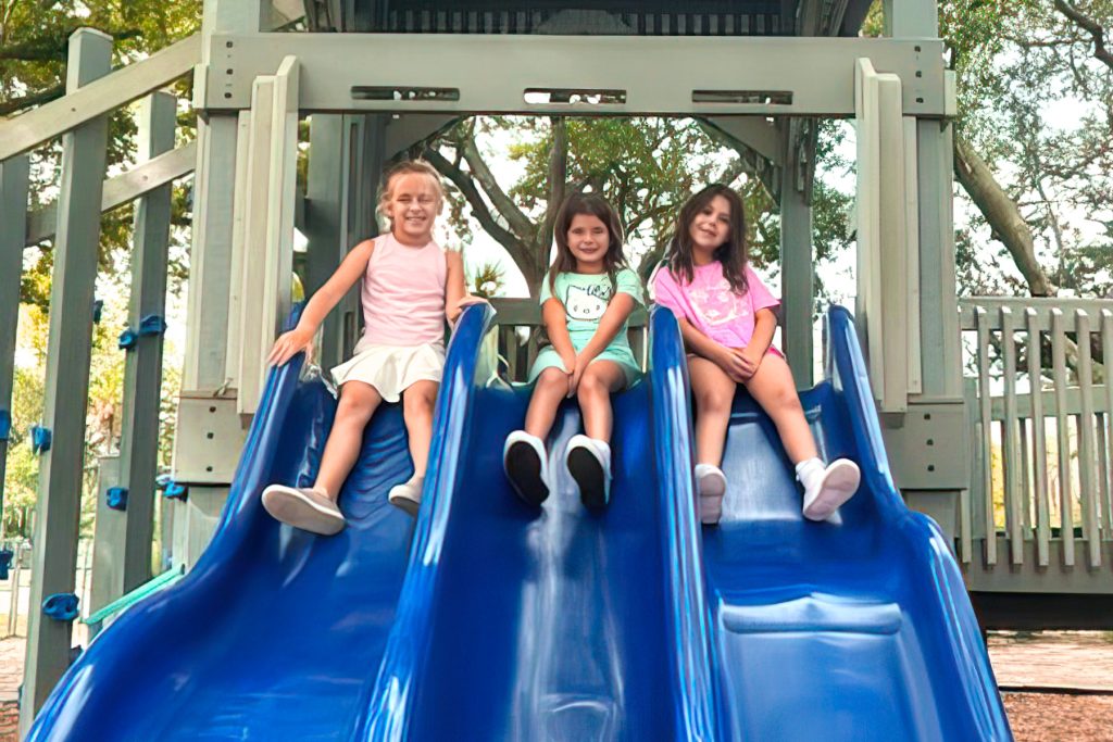 It’s playground time for Liza Dailey W., Aurora B., and Bryn L.