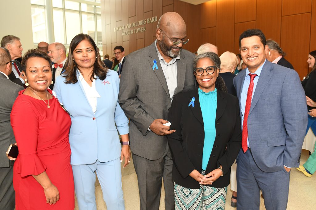 President of Baptist Medical Center Jacksonville Nicole Thomas, MHA, FACHE with Dr. Ruby Satpathy, MD, FACC, FSCAI, Isiah Owens, a mitral clip recipient and his wife Toni Owens, Dr. Siddarth “Sidd” Wayangankar, MD, MPH, FACC, FSCAI, RPVI, structural interventional cardiologist and director of the Cardiac Catheterization Lab at Baptist Health.