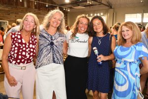 women smiling at camera at Rethreaded event