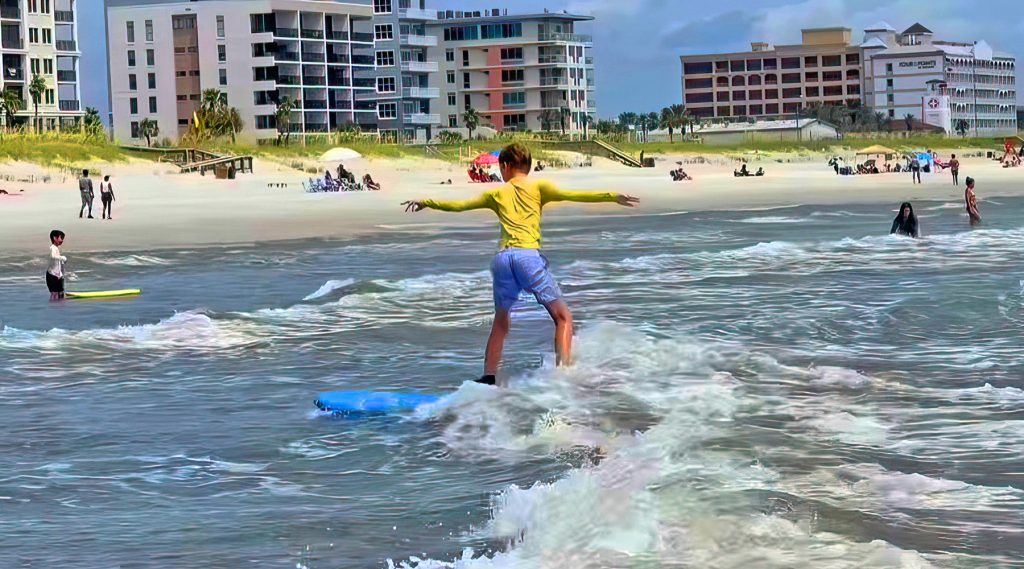 Campers catch some waves at Thompson Surf School in Jacksonville Beach.