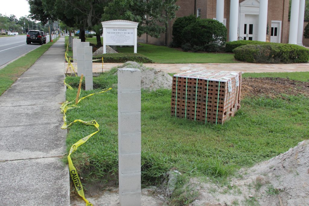 Work is underway to install a new perimeter fence at Southside Methodist Church.