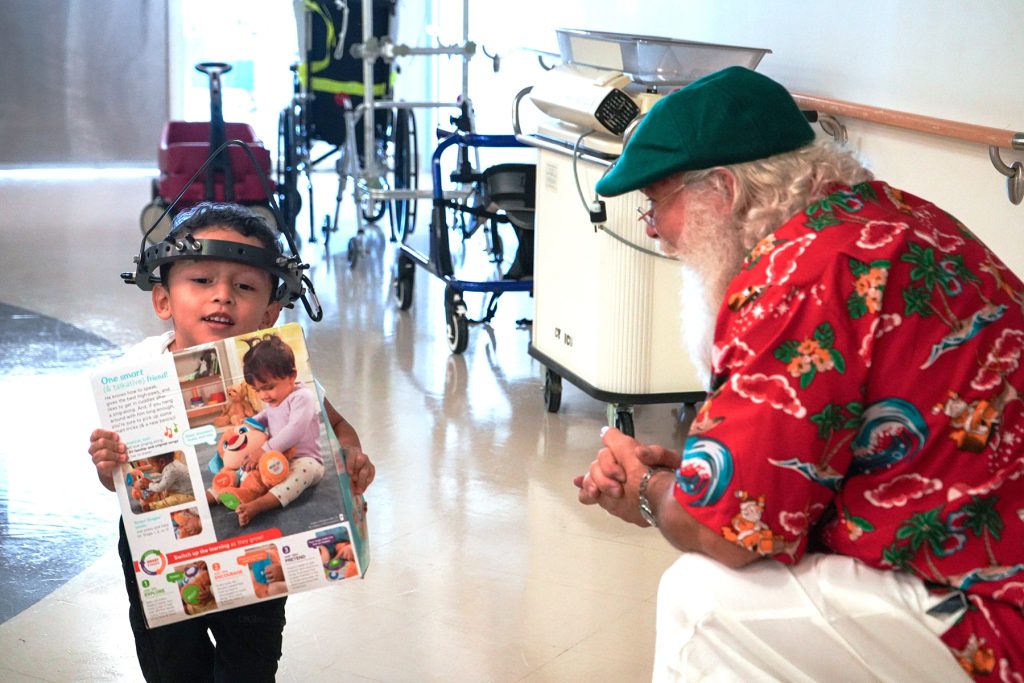 Jasser C. spends a moment with Santa.