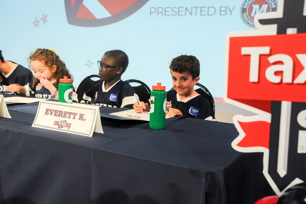 Everett K. signs his letter of intent to become a Dream Team member.