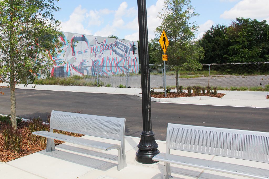 New benches on both sides of the street will allow residents to take in the murals along Park Street in Brooklyn.