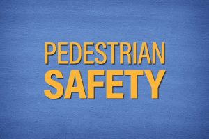 PEDESTRIAN SAFETY in yellow letters on blue background