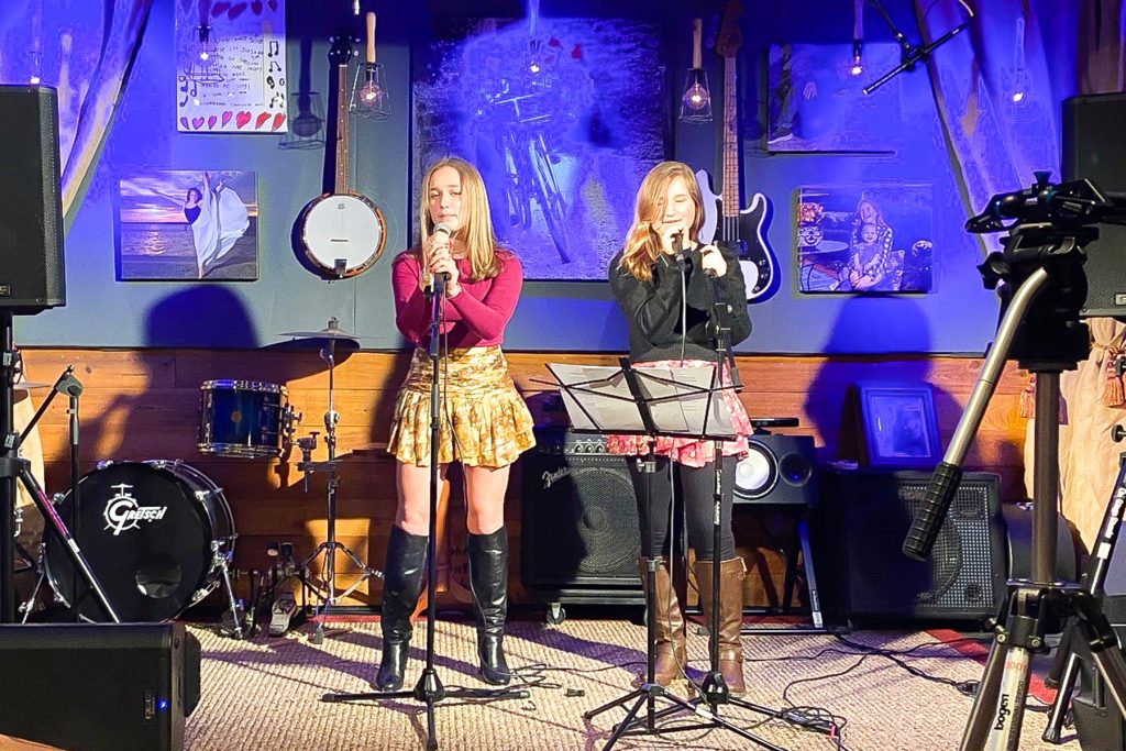Virginia Ann and Lilly enjoy the music studio their grandfather built.