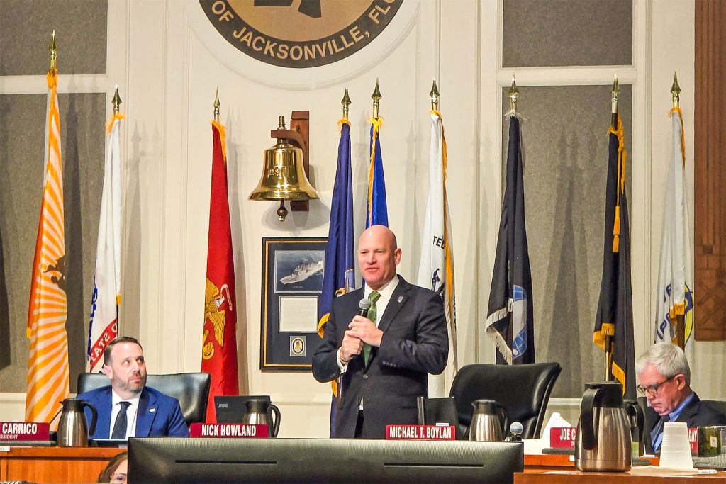 man speaking at meeting