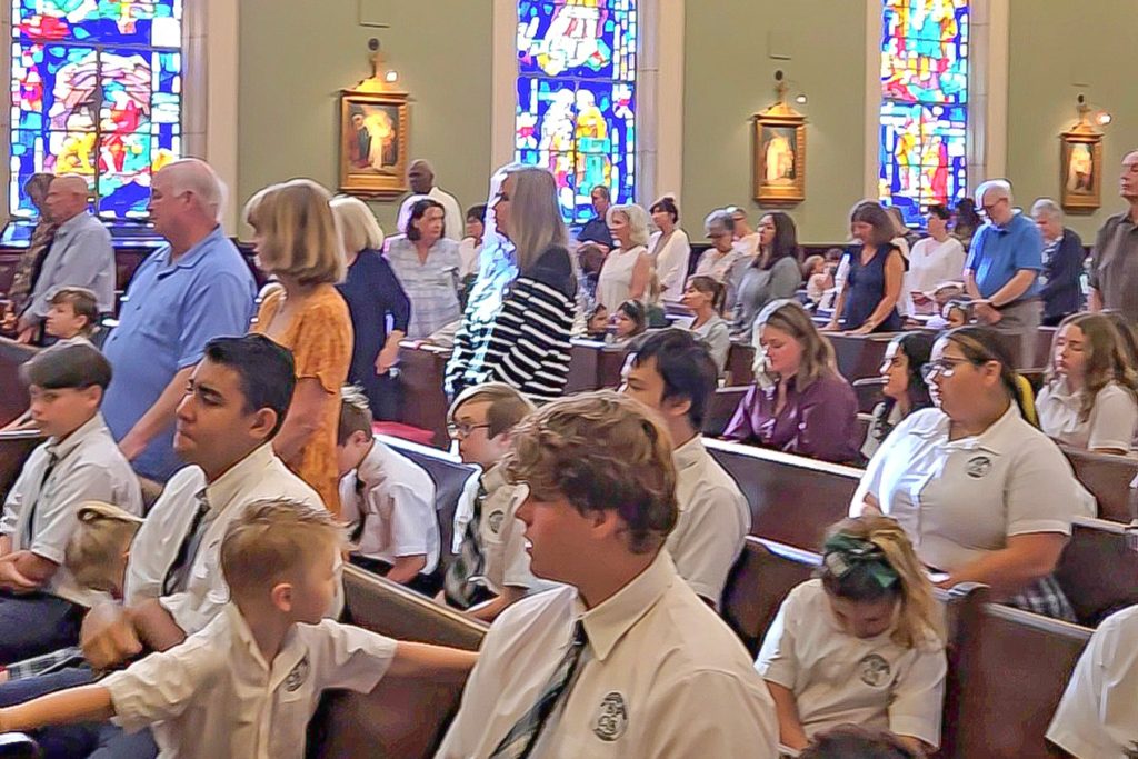 Grandparents standing and being recognized at Mass
