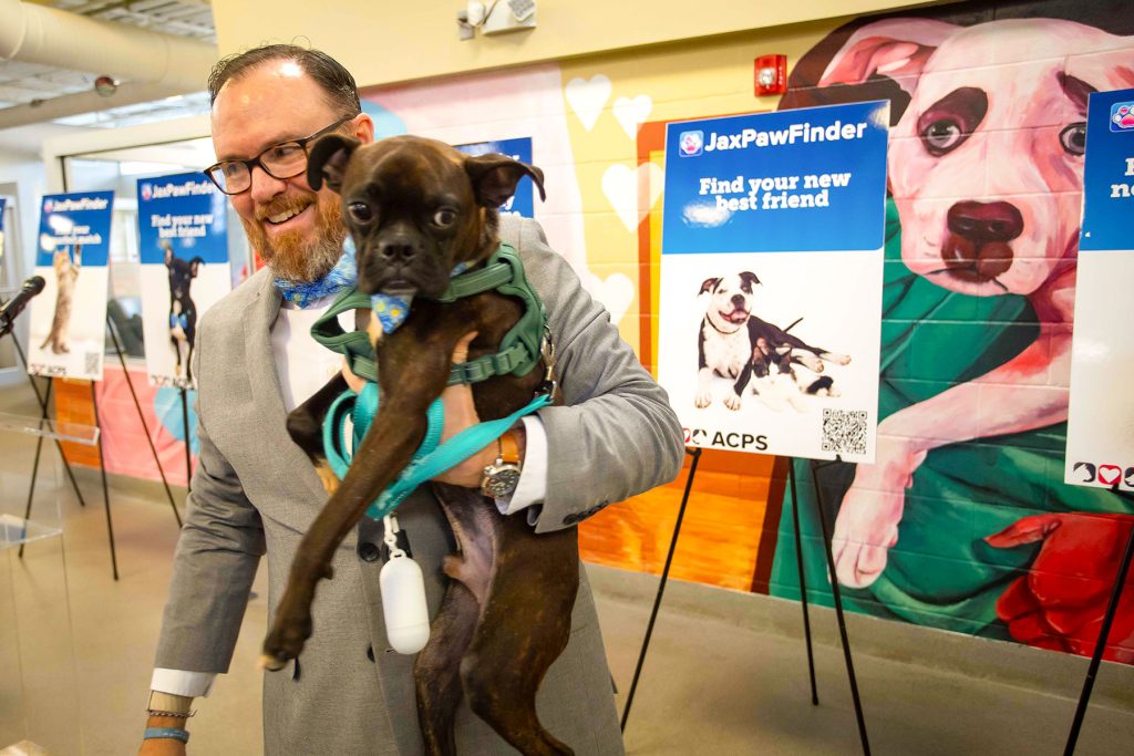 Jeff Moore adopted Sir Charles “Charlie” through the new JaxPawFinder app, and they attended the public launch together on October 8 at ACPS.