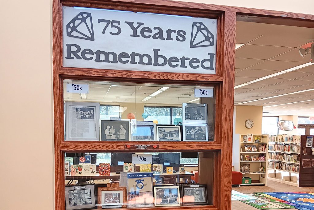 A display celebrates 75 years of memories at the San Marco library.