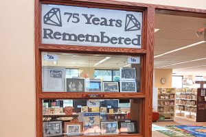 A display celebrates 75 years of memories at the San Marco library.