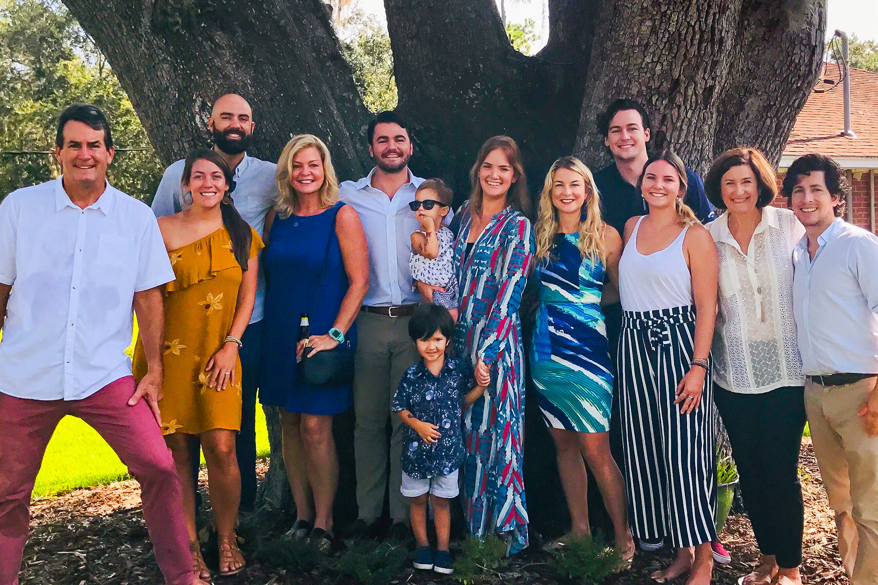 Steven “Apple” Beaver stands on the far left with his family in Granada.