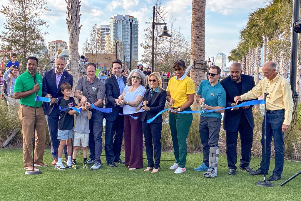 City officials and community stakeholders at the Nov. 24 ribbon cutting ceremony for the new RiversEdge Park.