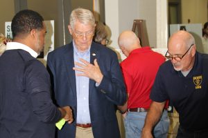 USS Orleck Naval Museum Ship Manager Jim Fossa, pictured right, and William Harrell discuss the latest design of the Shipyards West Park with Daryl Joseph, City of Jacksonville Parks, Recreation and Community Services director.