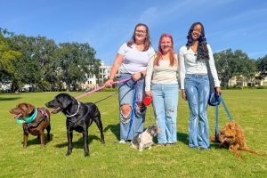 Wolfson Paw Society members and their pets: Brownie and Buddy with owner Natalie Shepard; Manny with owner Ella LeMieux and Lynah McElroy with her dog Franklin.