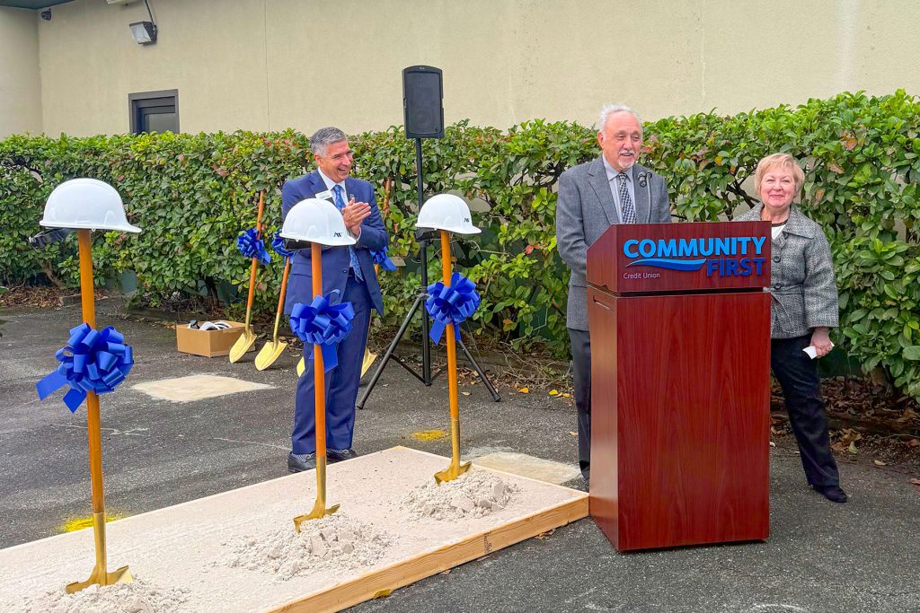 Gary and Sandy Polletta speak at the Jan. 26 groundbreaking for the incoming Murray Hill branch of Community First Credit Union. The Polletta family was the third family to own Edgewood Bakery, which they operated for 23 years. 