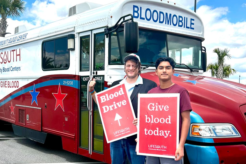 Arah Jain with James Skahn, Recruitment Manager at LifeSouth, leading a community blood drive at eTown Publix.