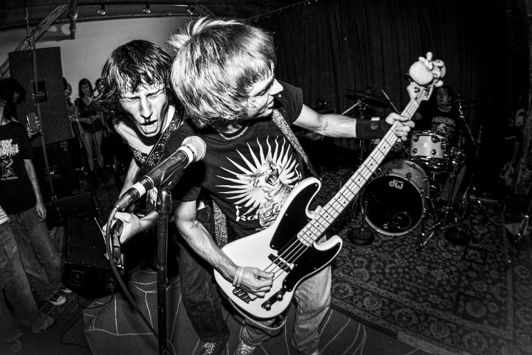 Joey Jenkins, in front, performs with bandmate, lead guitarist Jonas Gideons.