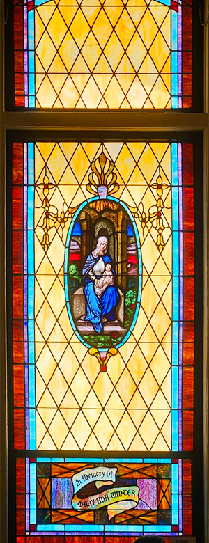 One of many stained-glass windows in the sanctuary honoring women