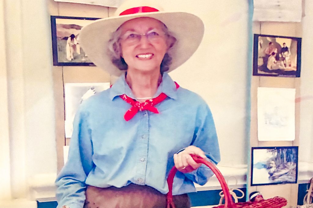 Betsy dresses up as a grown-up version of Lois Lenski’s “Strawberry Girl.”
