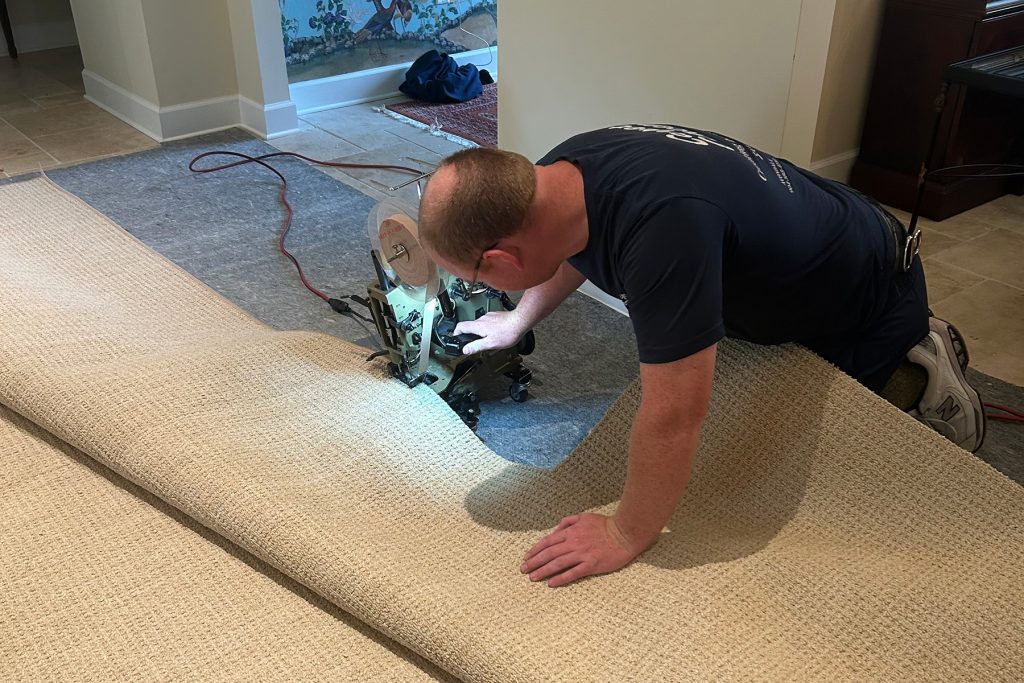 Mark Stone installing carpet
