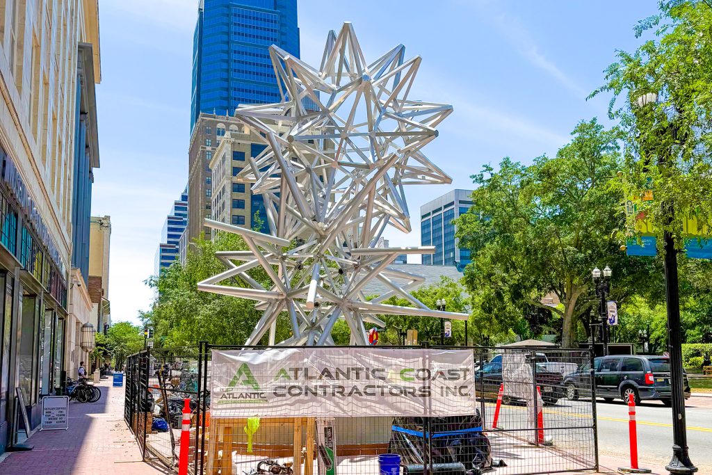 Construction crews are working to install “Jacksonville Stacked Stars” on the Laura Street sidewalk in front of MOCA in Downtown Jacksonville.