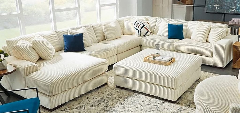 white sofa sectional with blue accent pieces