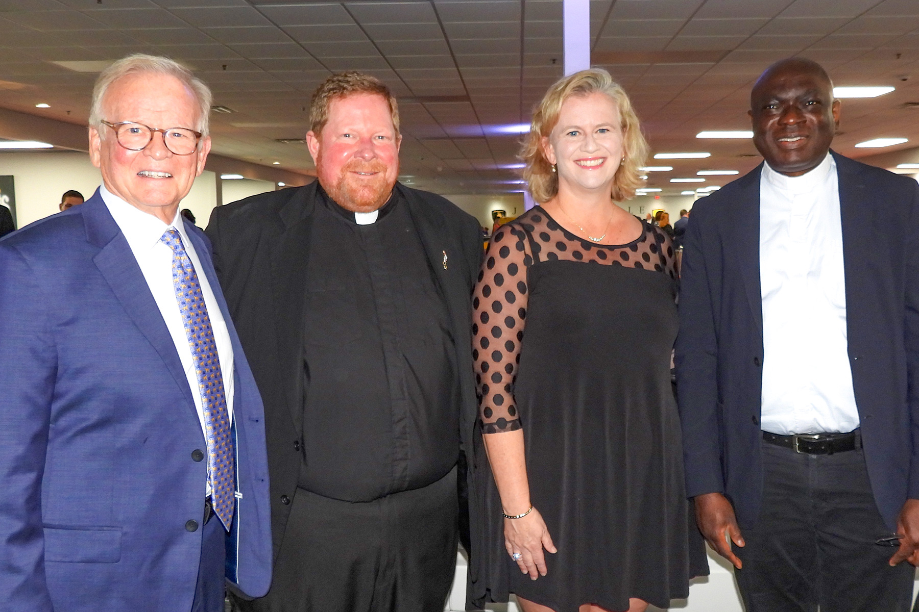 Jerry Weedon with Father Jason Trull, Lauren Weedon and Father Sebastian Musa