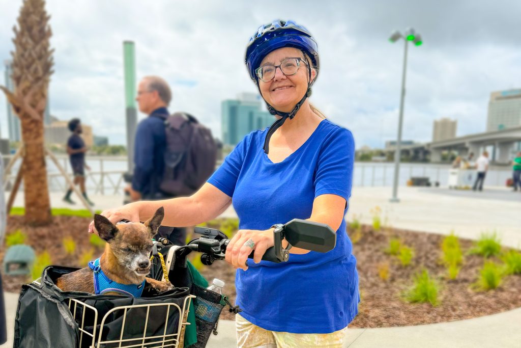 Sandra Litchfield looks forward to biking along the newly reopened Northbank Riverwalk and by the Riverfront Music Garden with her dog, Bella.