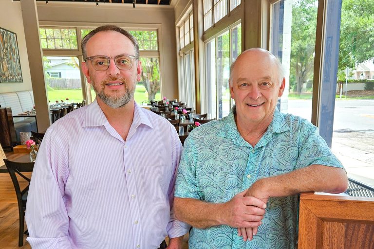 Hughes Brown and his father, Jerry, at the newly opened Oxford Place