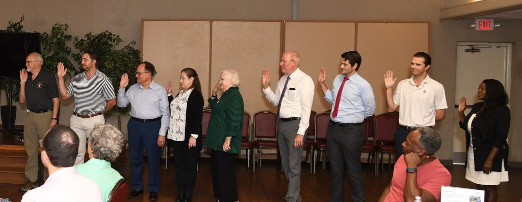 The 2026-27 slate of officers recite the pledge of office at the June 23 club meeting.