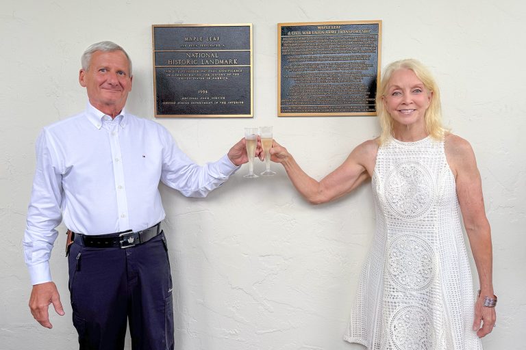 FYC members Dr. Keith Holland and Khaki Hager celebrate the unveiling of two historical plaques commemorating the “Maple Leaf” shipwreck.